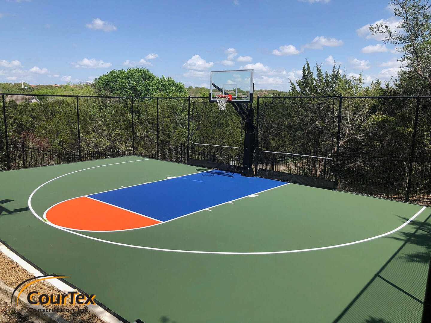 Weather-resistant private basketball half-court with custom color scheme – Engineered for year-round play in any climate.
