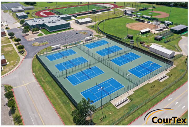 Aerial view of eight newly resurfaced tennis courts by CourTex