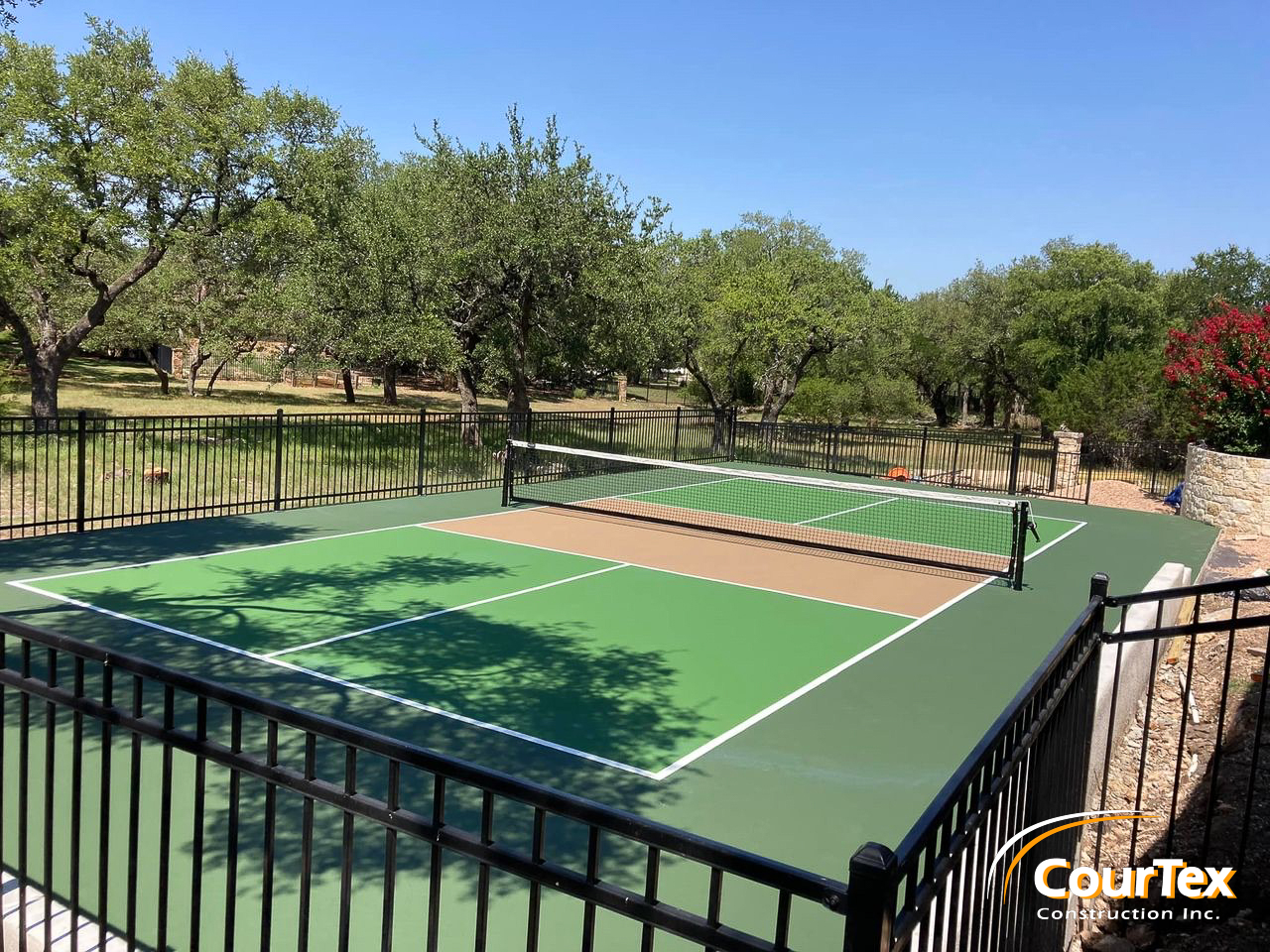 Luxury backyard pickleball court construction in the Houston area.